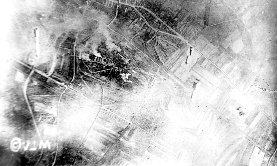 Bombs dropping on German ammunition dump, St. Miehel sector, France, 1918 (32689589935)