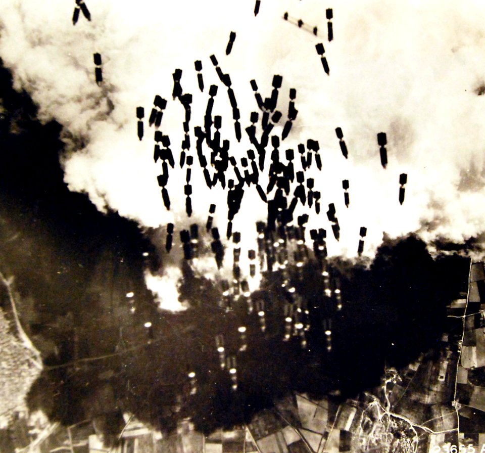 Bombs from a B-17 Flying Fortress falling on Monserrato Airfield near Cagliari, Sardinia, 1943 (26683983423)