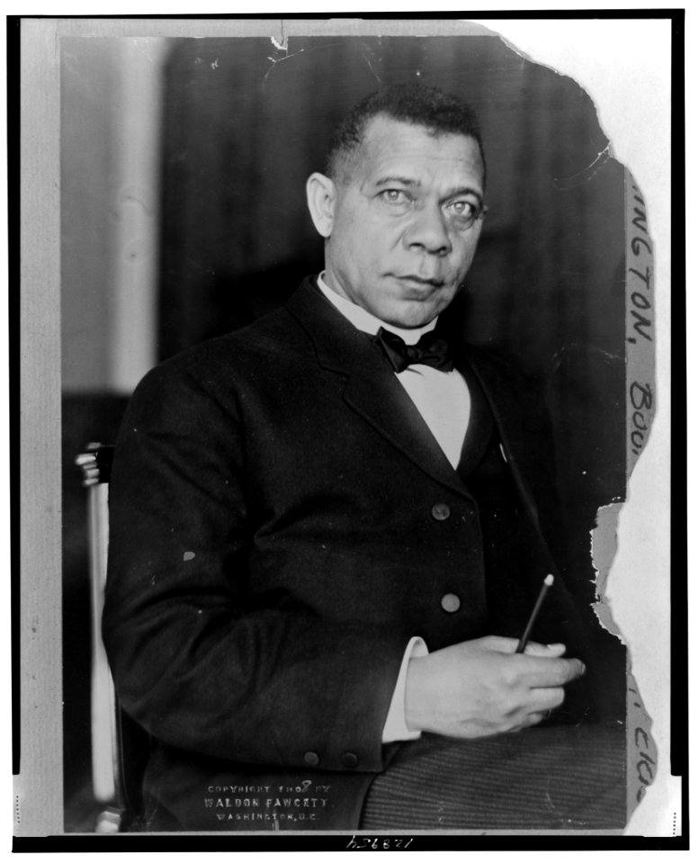 Booker T. Washington, three-quarter length portrait, seated, facing slightly right with right hand in lap LCCN2001700490