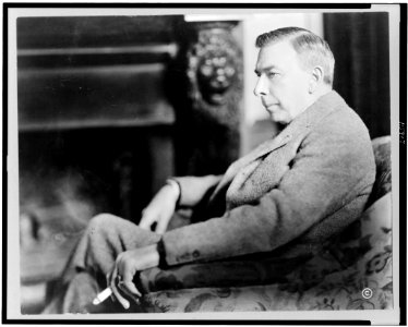 Booth Tarkington, three-quarter length portrait, seated, facing left LCCN96502406 photo