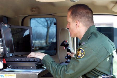 Border Patrol Agent Operates Mobile Equipment photo
