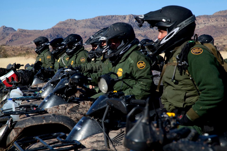 Border Patrol Agents in Line Formation on Motor Bikes