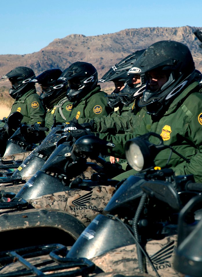 Border Patrol Agents in Line Formation on Motor Bikes - 8467646975