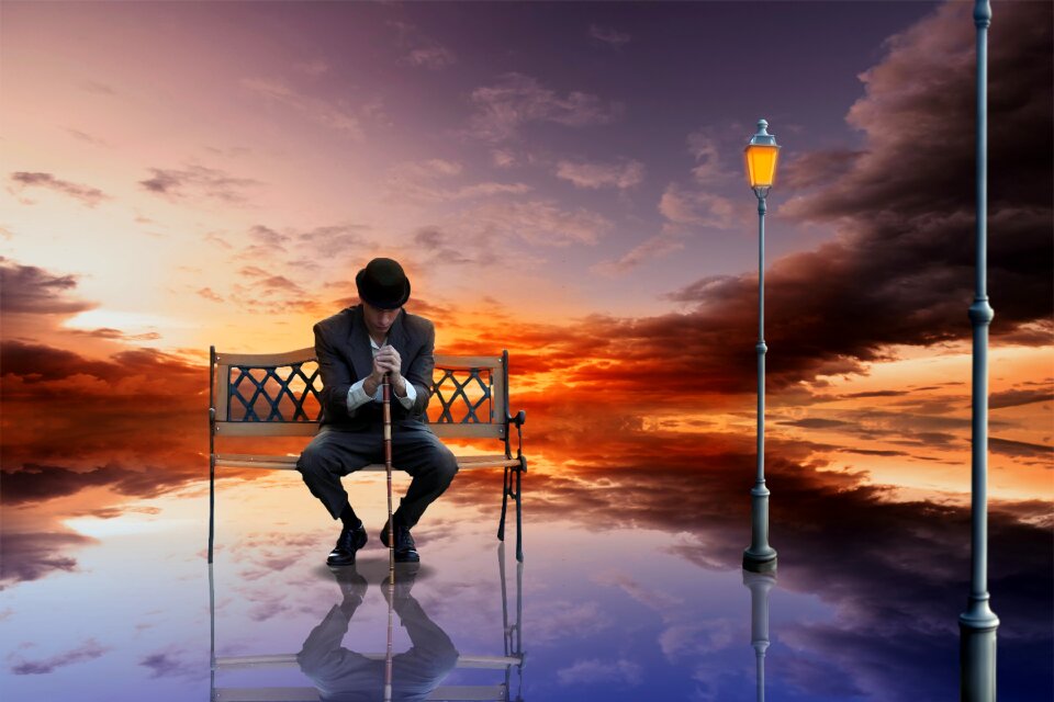 Sunset man sitting reflection