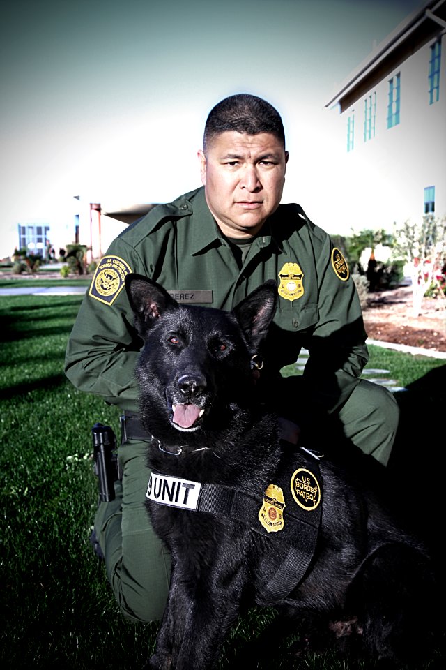 Border Patrol Agent Poses with Canine Partner