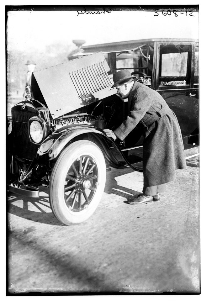 Chamlee (looking at motor of auto) LCCN2014713653