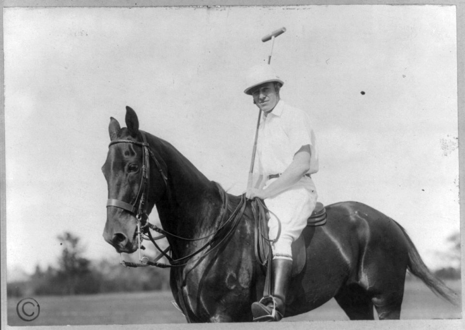 Charles Cary Rumsey, 1879-1922, full length portrait, seated on horse with polo mallet, facing left LCCN2005688969