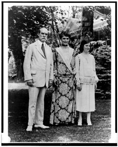 Charles Evans Hughes, wife, and daughter, standing on lawn LCCN98507080
