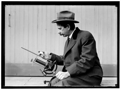 Charles Greeley Abbot, astrophysicist and Secretary of the Smithsonian, with his device- a silver-disc pyrheliometer which measures direct beam solar irradiance LOC hec.04702