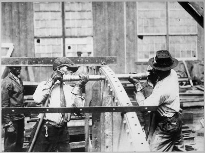 Charles Knight (left) who won the prize offered by the London Mail for expert rivet driving. He drove 4,875 rivets in ni - NARA - 533743 photo