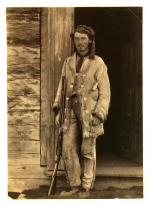 Charles W. Wilson, full-length portrait, standing, facing front, wearing buckskins, with rifle LCCN2005680424