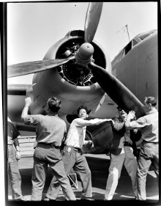 Checking finished PV-1 at the Vega aircraft plant, Burbank, Calif. Workmen spin propeller. - NARA - 520736 photo
