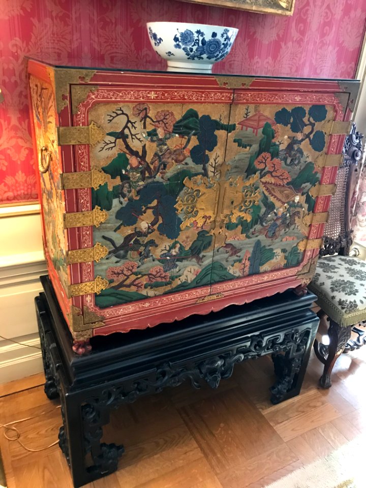 Chest with inlaid figures on Teakwood base