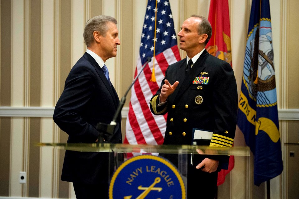 Chief of Naval Operations Adm. Jonathan Greenert, right, speaks with William Cohen, the chief executive officer of The Cohen Group, at the Navy League's Sea-Air-Space Exposition in National Harbor, Md., April 8 130408-N-WL435-157