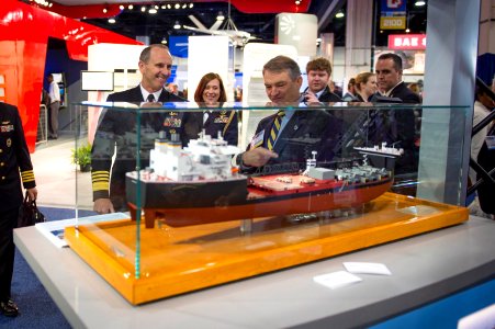 Chief of Naval Operations Adm. Jonathan Greenert, left, looks at a small scale model of the innovative new mobile landing platform ship at the Navy League's Sea-Air-Space Exposition in National Harbor, Md 130408-N-WL435-408