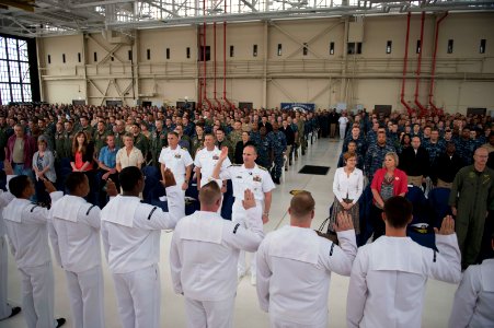 Chief of Naval Operations U.S. Navy Adm. Jonathan W. Greenert, middle center, reenlists Sailors at an all-hands call at Naval Air Station Jacksonville, Fla., May 3, 2013 130503-N-WL435-826 photo