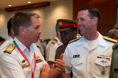Chief of Naval Operations Adm. John Richardson (CNO) talks with the head of the Royal Australian Navy, Chief of Navy Vice Adm. Tim Barrett, during India's International Fleet Review (IFR) 2016