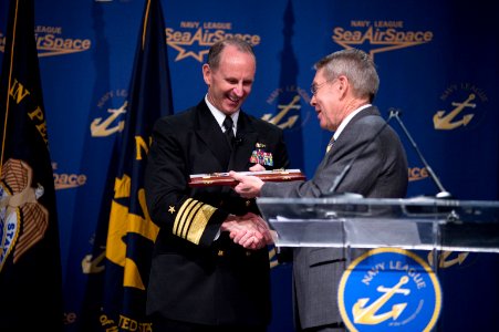 Chief of Naval Operations Adm. Jonathan Greenert receives a gift from U.S. Navy League National President Philip Dunmire after concluding the keynote address at the Navy League's Sea-Air-Space Exposition 130408-N-WL435-696