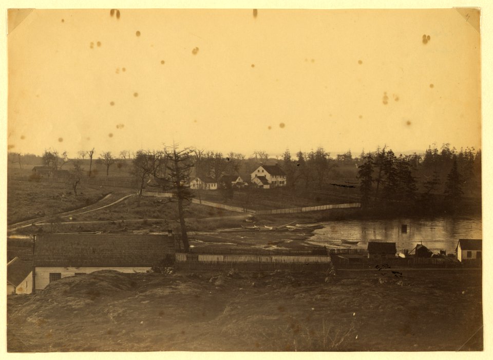 Community adjacent to the fur trading post at Fort Victoria on Vancouver Island, British Columbia showing farm and buildings LCCN2005680425