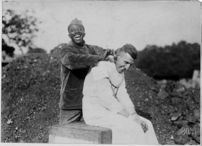 Company barber at American Red Cross, Hospital Number 5, Auteuil, France. - NARA - 533538 photo