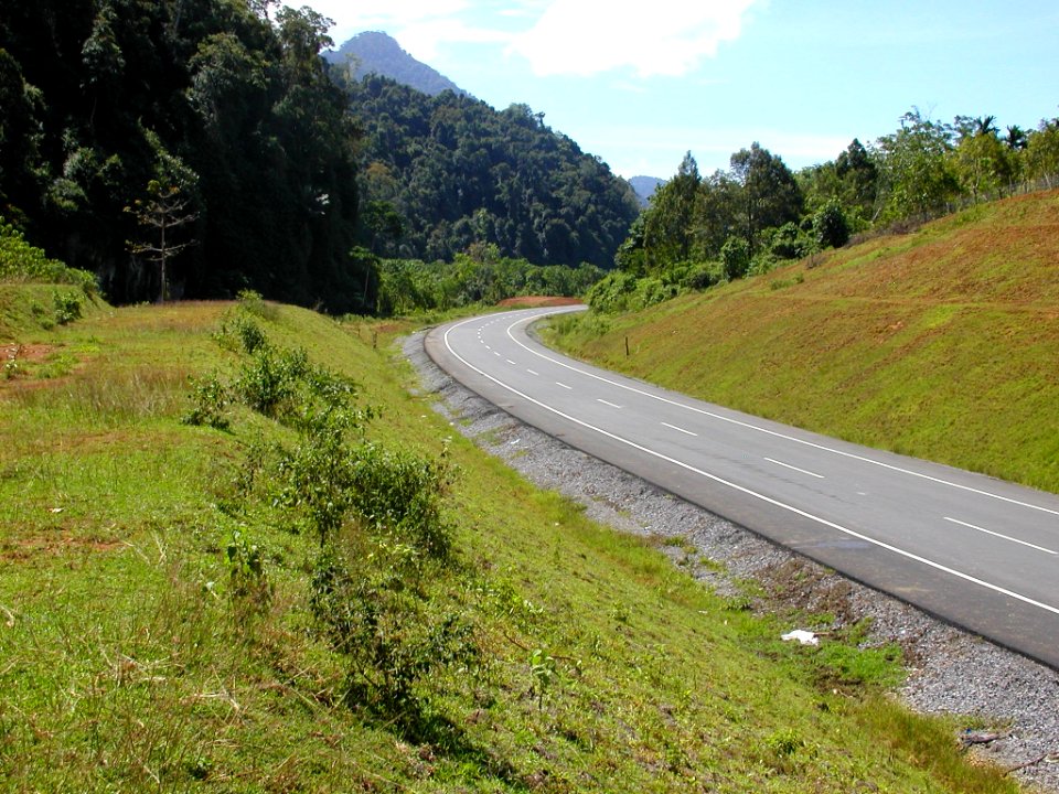 Completed section of highway through previous jungle swamp area at Lhoong (4275094635)