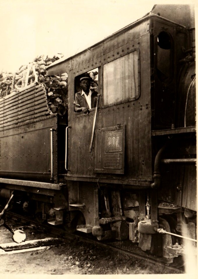 Congo Railways - Compagnie du Chemin de Fer du Katanga (CFK) - a locomotive driver looking out of the window of 2-8-2 steam locomotive Nr. 301