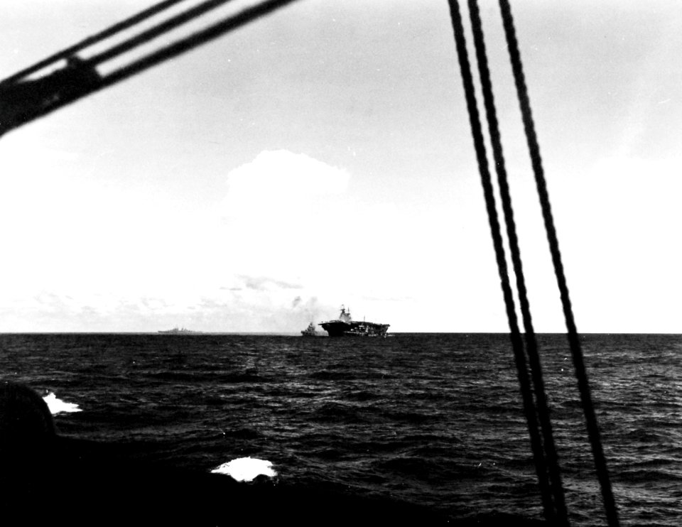 Destroyers assist the listing USS Hornet (CV-8) during the Battle of Santa Cruz Islands, 26 October 1942 (80-G-33895)