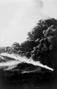 Detail of German flamethrower in use in 1915, from- Liquid fire used in trenches by Germans LCCN2011645179 (cropped)