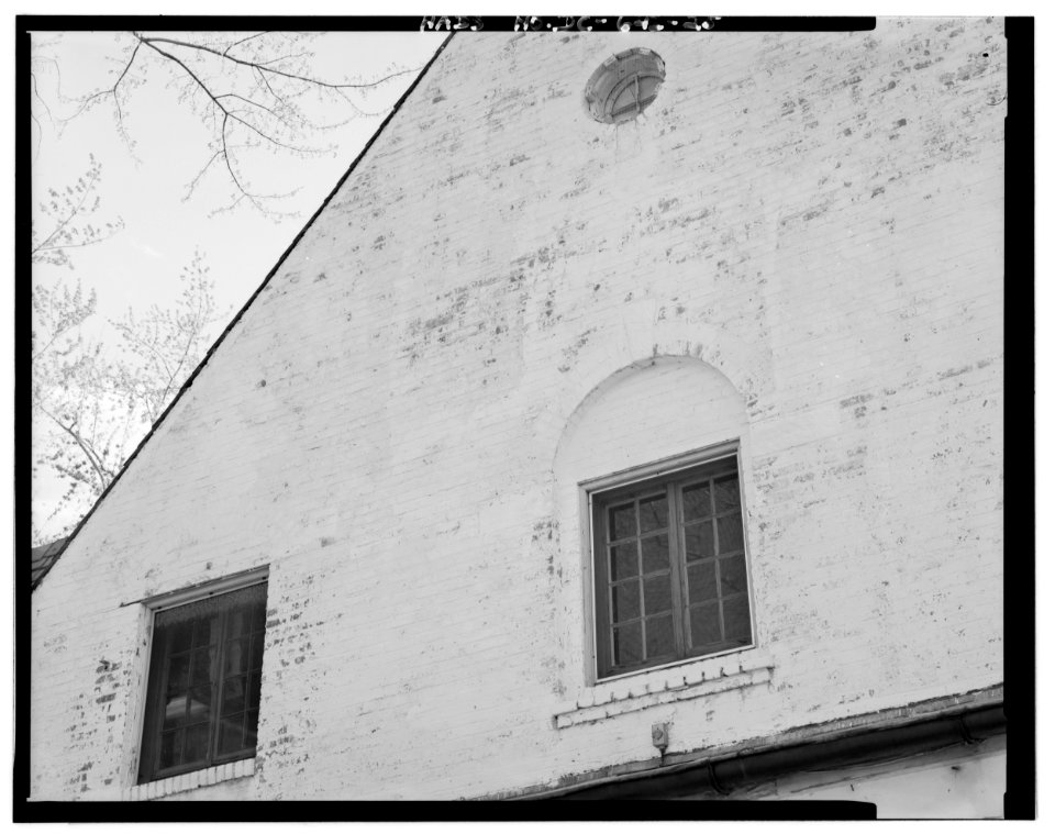 Detail of center gable, northeast facade
