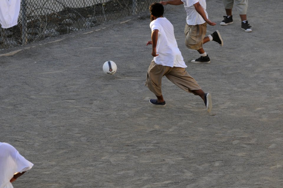 Detainees play soccer in the recreation area of Camp Six DVIDS373558