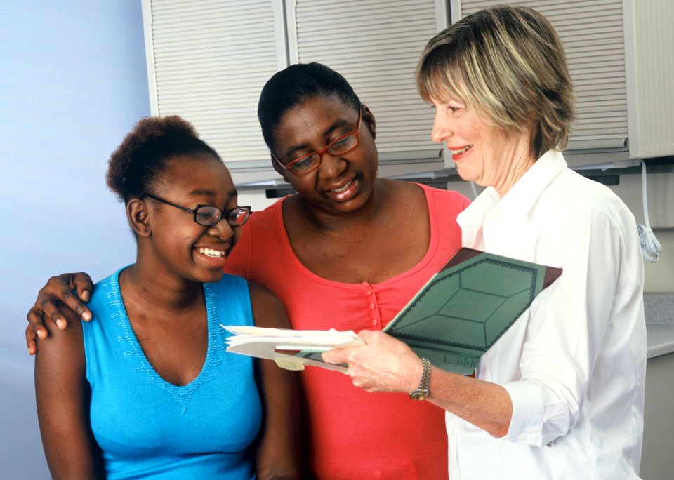 Doctor consults with family photo