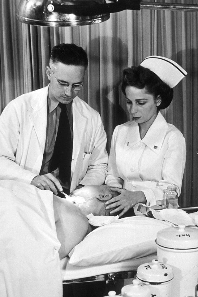 Doctor changing dressing