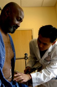 Doctor examines patient (3) photo