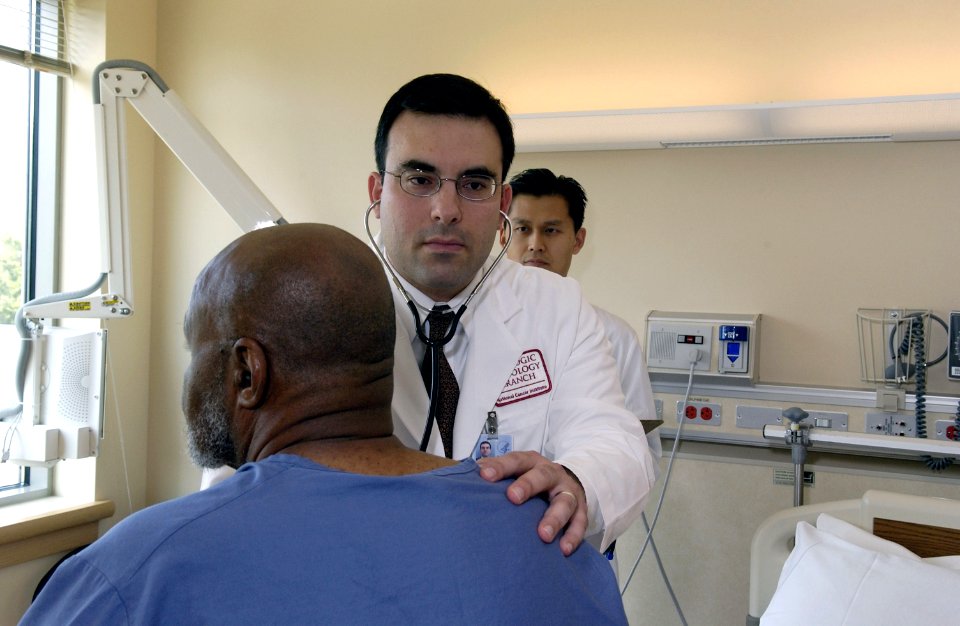 Doctor examines patient (2) photo