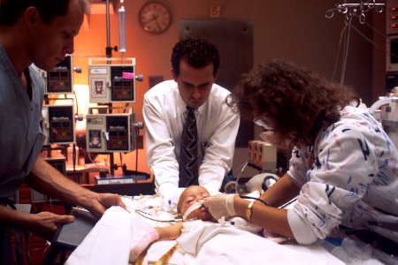 Doctor treats ICU pediatrics patient