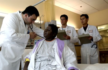 Doctor examines patient with stethoscope (1) photo
