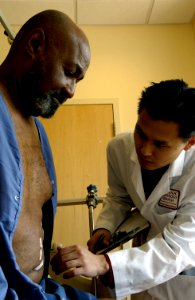 Doctor examines patient (4) photo