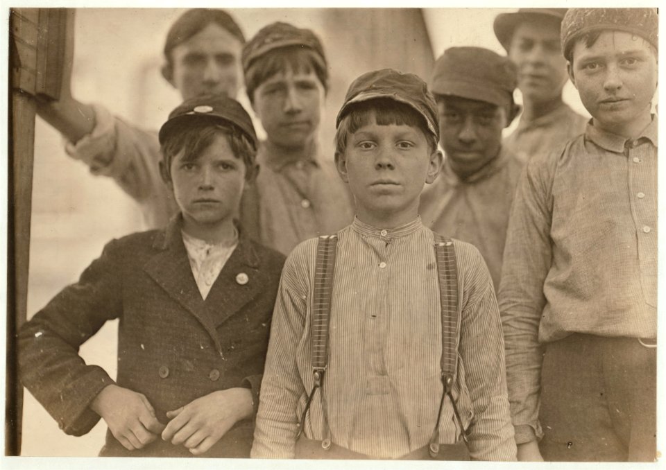 Doffers in Willingham Cotton Mill, Macon, Ga. The three boys in front row have been in mill work for 4, 5 and 6 years respectively. LOC nclc.01625