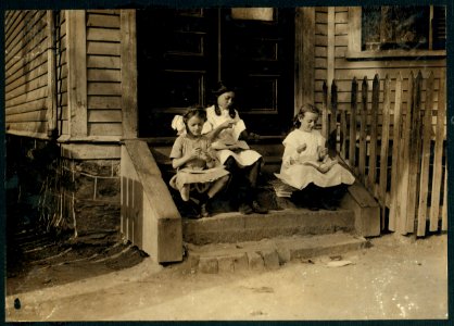 Doing tags on steps of house near Dennison factory on Vale Street, Roxbury, Mass. LOC nclc.04254