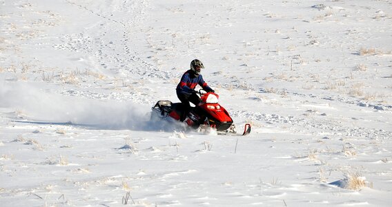 Action snowmobile mountains