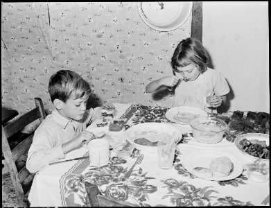 Donald and Wanda Lee Sergent, coal loader's children, eating breakfast. P V & K Coal Company, Clover Gap Mine... - NARA - 541382