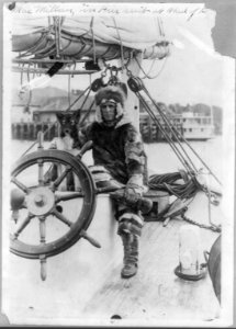 Donald MacMillan in fur suit at wheel of ship Bowdoin LCCN2016653125