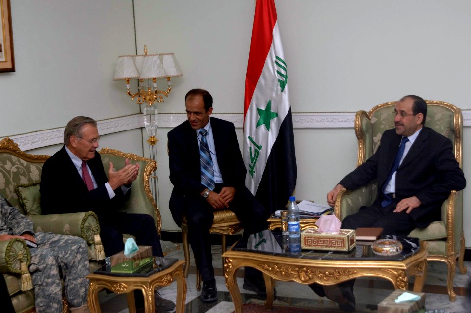 Donald Rumsfeld speaks with Nouri al-Maliki