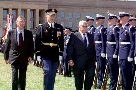 Donald Rumsfeld, Ariel Sharon, and Thomas Jordan inspects the troops at the River Parade Field