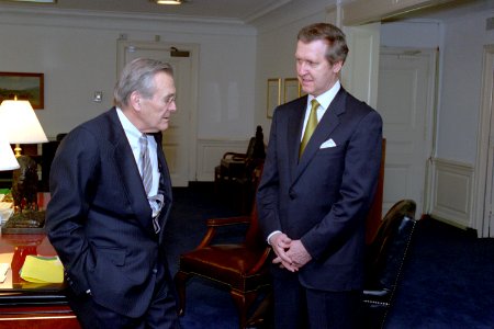 Donald Rumsfeld talks with William Cohen