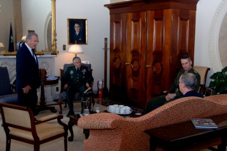 Donald Rumsfeld, George Casey, and Peter Pace speak with Mitch McConnell