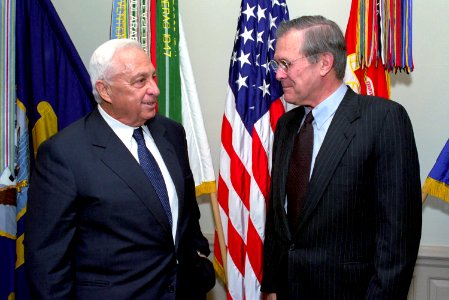 Donald Rumsfeld and Ariel Sharon pose for a picture