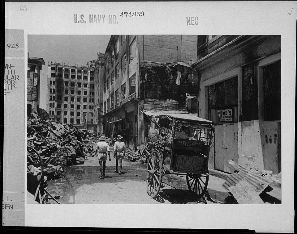 Devastated downtown Manila with a 'calesa' (popular form of transportation in Philippines) in foreground. - NARA - 520953