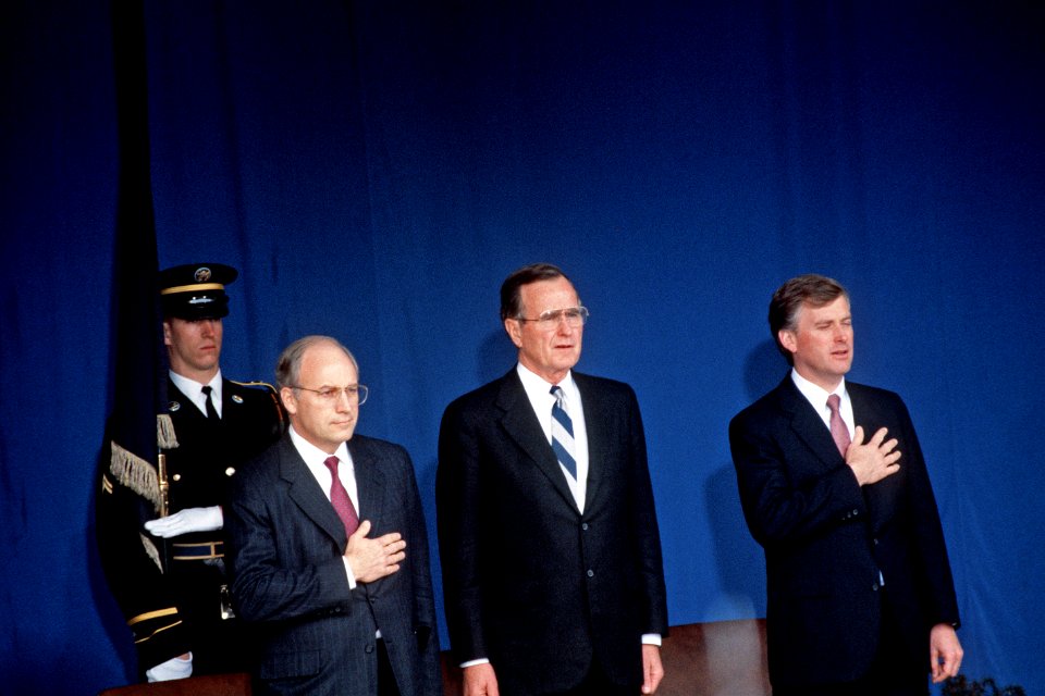 Dick Cheney, George H. W. Bush, and Dan Quayle honor the flag during the ceremony at the Pentagon