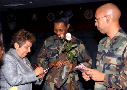 Donna Shalala signs an autograph for U.S. Air Force TECH. SGT. Lewi